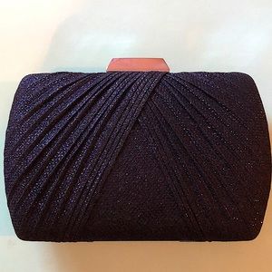 Black glittery clutch. Only used twice. Can be used with or without the chain.